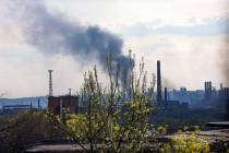 Smoke rises from the Metallurgical Combine Azovstal in Mariupol, in territory under the governm ...