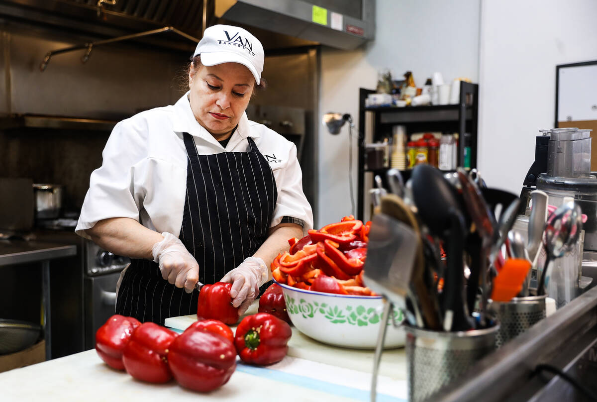 Arsho Hovsepian cuts bell peppers for an Armenian dish called adjka at Van Bakery in Las Vegas, ...