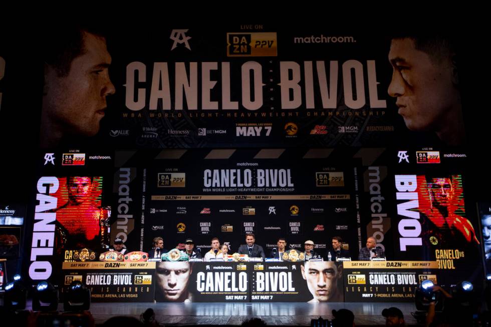 Saul “Canelo” Alvarez and Dmitry Bivol participate during a press conference at t ...