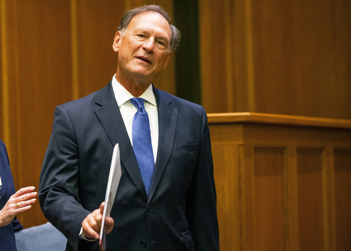 Supreme Court Justice Samuel Alito waves before addressing the audience during the "The Emergen ...