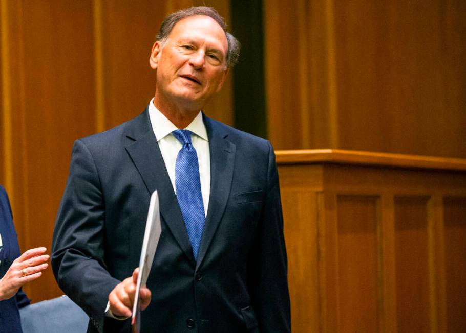 Supreme Court Justice Samuel Alito waves before addressing the audience during the "The Emergen ...