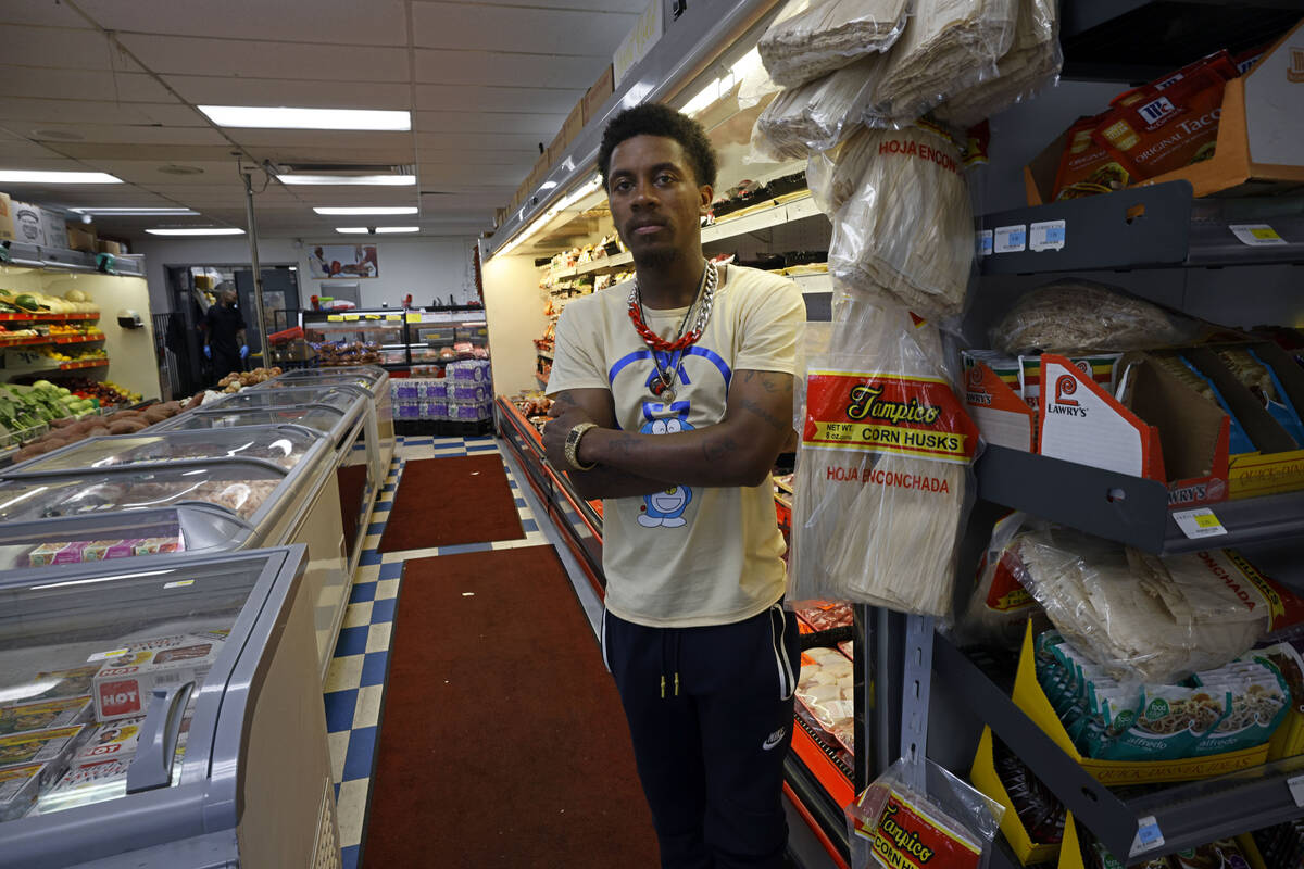Mario's Westside Market employee Johnathan Bell poses for a photo in the store, Friday, May 6, ...