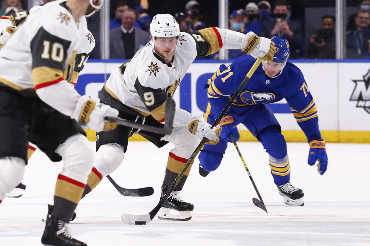 Vegas Golden Knights center Jack Eichel (9) carries the puck past Buffalo Sabres left wing Vict ...