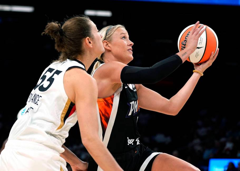 Phoenix Mercury's Sophie Cunningham drives past Las Vegas Aces' Theresa Plaisance (55) during t ...