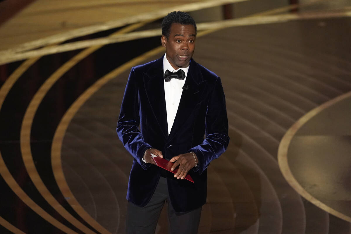 Chris Rock presents the award for best documentary feature at the Oscars on Sunday, March 27, 2 ...