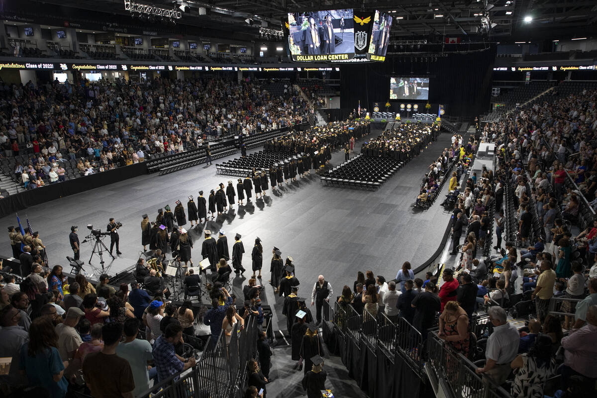 Graduates file in during commencement for Nevada State College at Dollar Loan Center Arena on S ...
