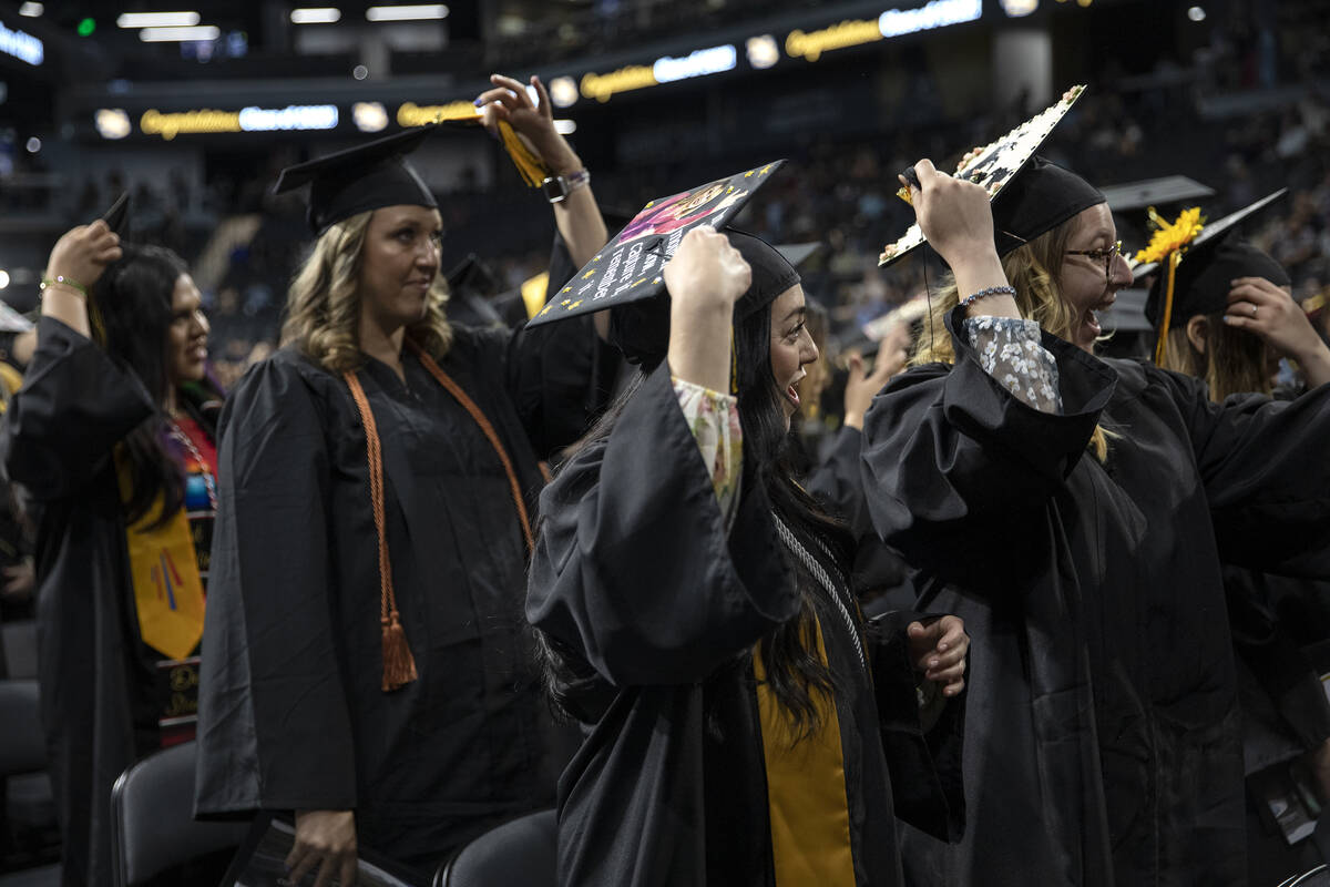 Graduates move their tassels from right to left during commencement for Nevada State College at ...