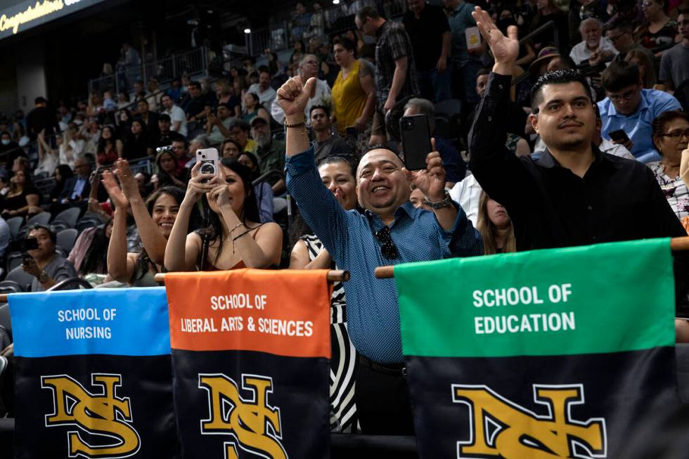Attendees of commencement for Nevada State College cheer for their graduates at Dollar Loan Cen ...