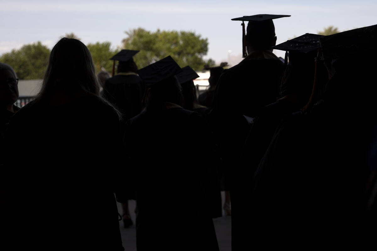 Graduates exit after commencement for Nevada State College at Dollar Loan Center Arena on Satur ...