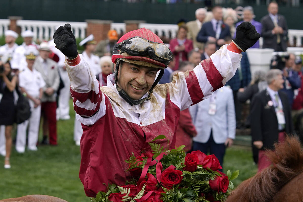 Jockey Sonny Leon celebrates in the winner's circle after Rich Strike won the 148th running of ...