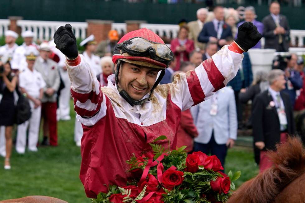 Jockey Sonny Leon celebrates in the winner's circle after Rich Strike won the 148th running of ...