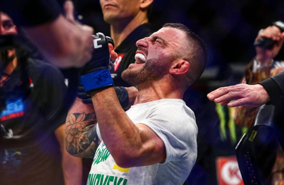 Alexander Volkanovski reacts after being declared the winner via unanimous decision over Max Ho ...