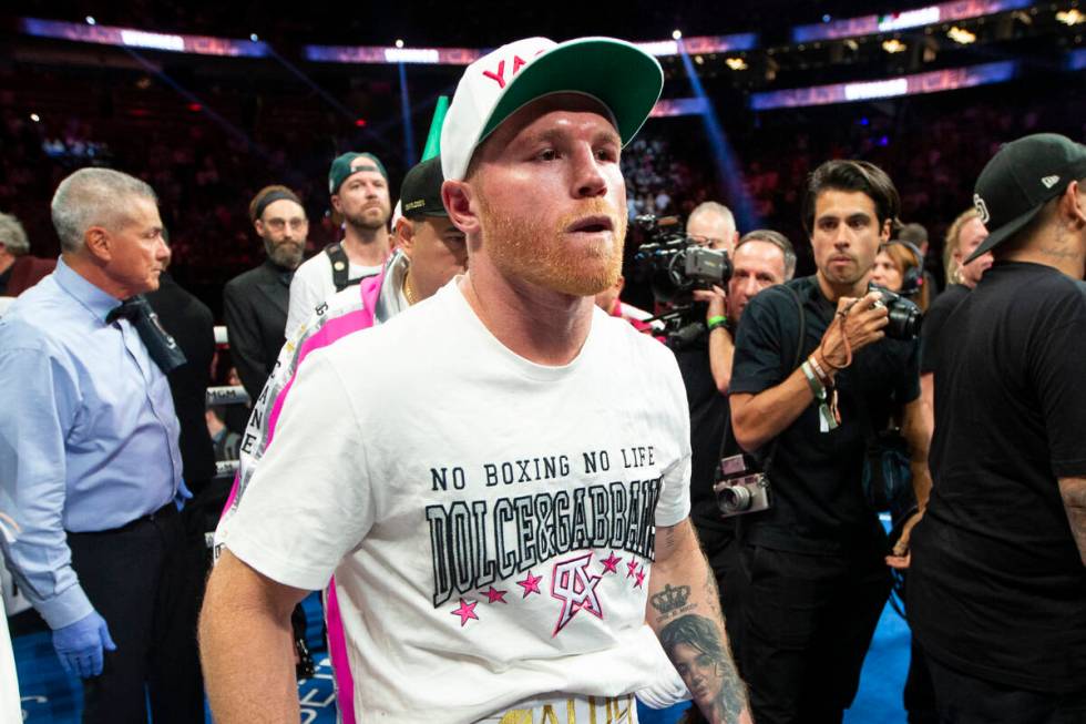Saul “Canelo” Alvarez leaves the ring after his unanimous decision loss against Dmitry Bivo ...