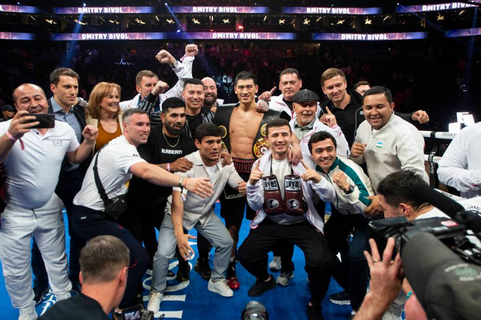 Dmitry Bivol poses with his team after his unanimous decision win against Saul “Canelo&# ...