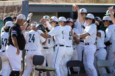 Palo Verde High School outfielder Kyle Williamson (24) congratulated by his teammates after hi ...