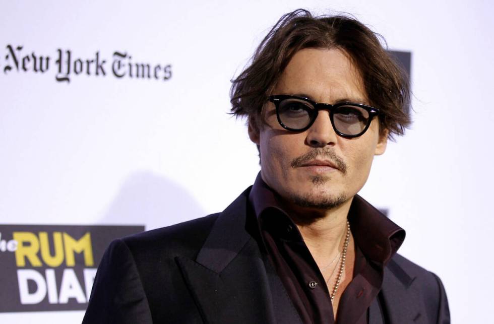 Cast member Johnny Depp arrives at the premiere of "The Rum Diary" in Los Angeles, Th ...