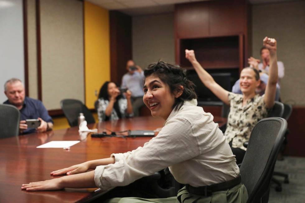 Cecilia Reyes, of the Chicago Tribune, reacts as she and Madison Hopkins of the Better Governme ...