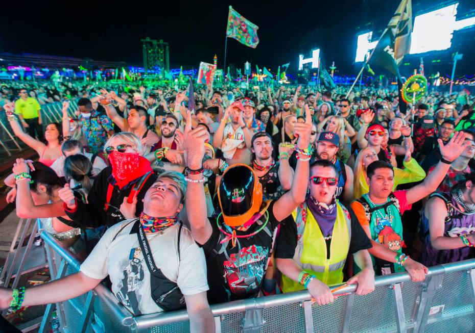 Concert goers dance at the Circuit Grounds stage during day two of Electric Daisy Carnival at L ...