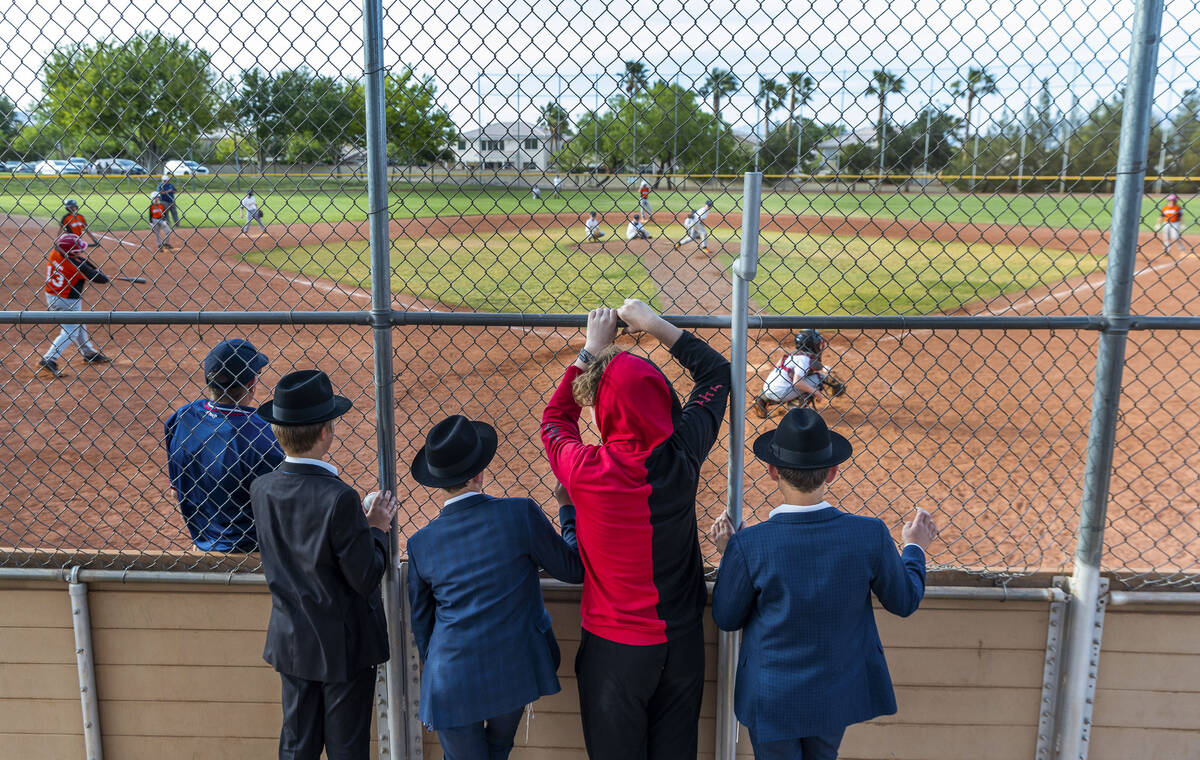 Boys watch the action from behind home plate as the Giants battle the Brewers for a Summerlin L ...