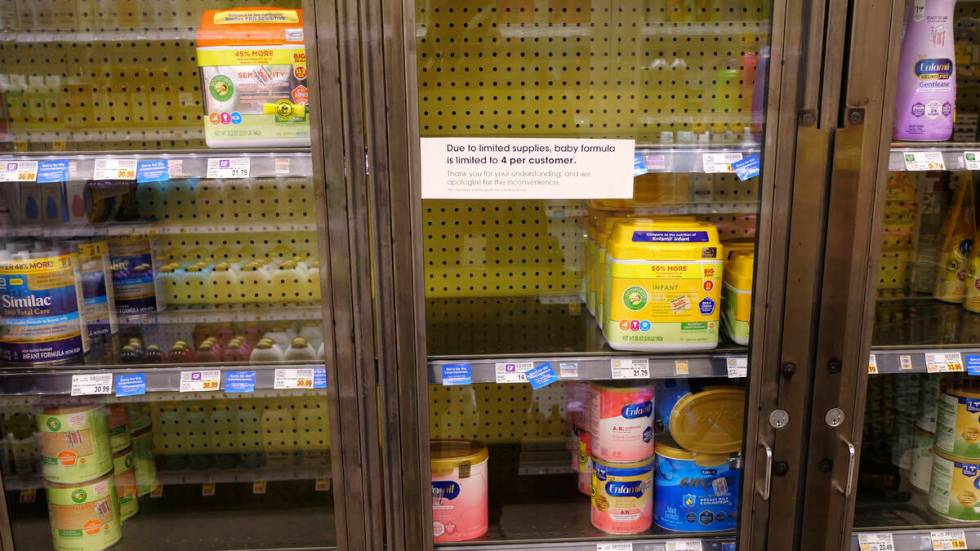 A due to limited supplies sign is shown on the baby formula shelf at a grocery store Tuesday, M ...