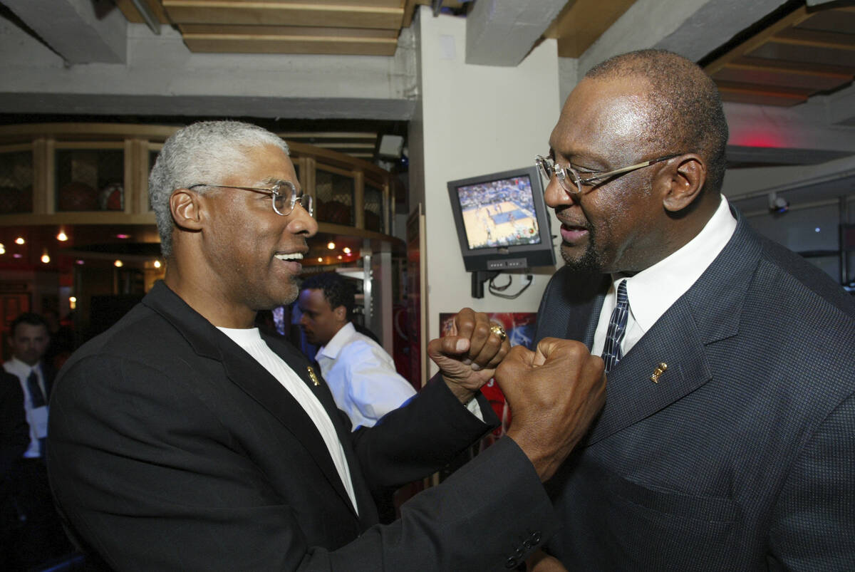 FILE -NBA legend Julius 'Dr. J' Erving, left, greets former Milwaukee Bucks' Bob Lanier during ...