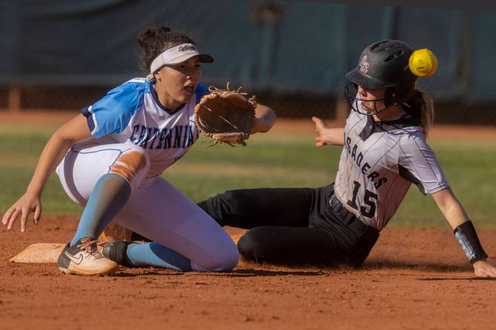 Faith Lutheran’s Savannah Moore (15) tries to slide in safely past Centennial’s K ...