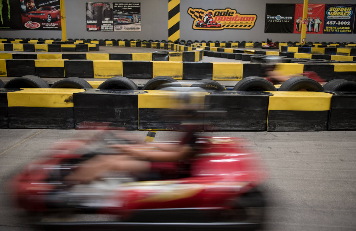 Kart racers accelerate around the track at Pole Position Raceway on Saturday, July 22, 2017, in ...
