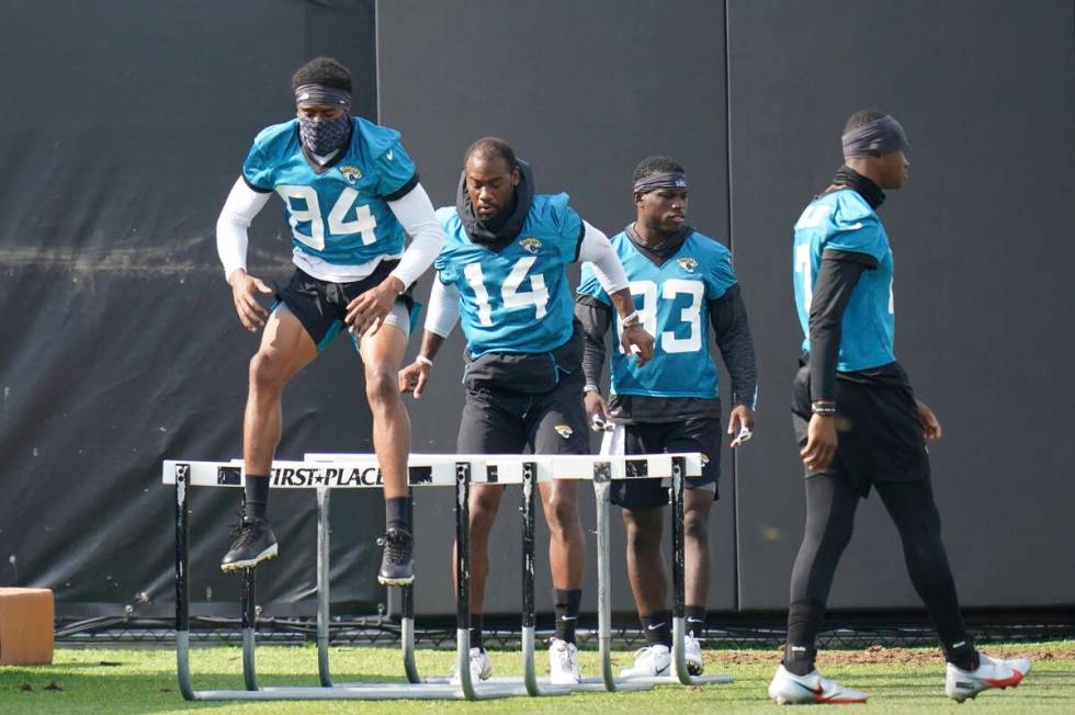 Jacksonville Jaguars players from left, wide receiver Keenan Cole (84), wide receiver Terry God ...