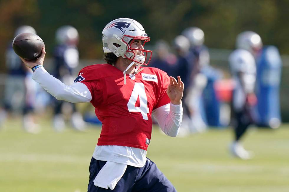 New England Patriots quarterback Jarrett Stidham (4) winds up to pass during an NFL football pr ...