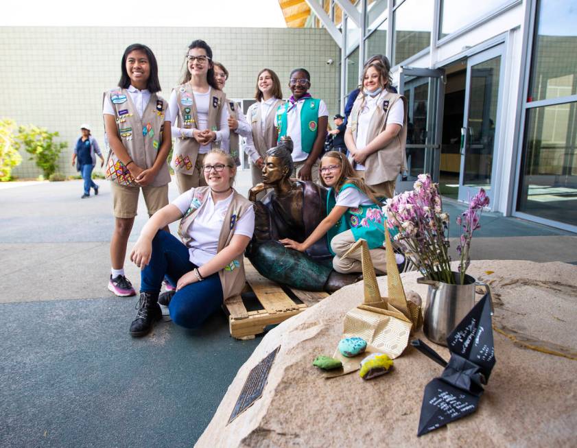 Girl Scouts from different troops gather around the statue “In Grace” which had b ...
