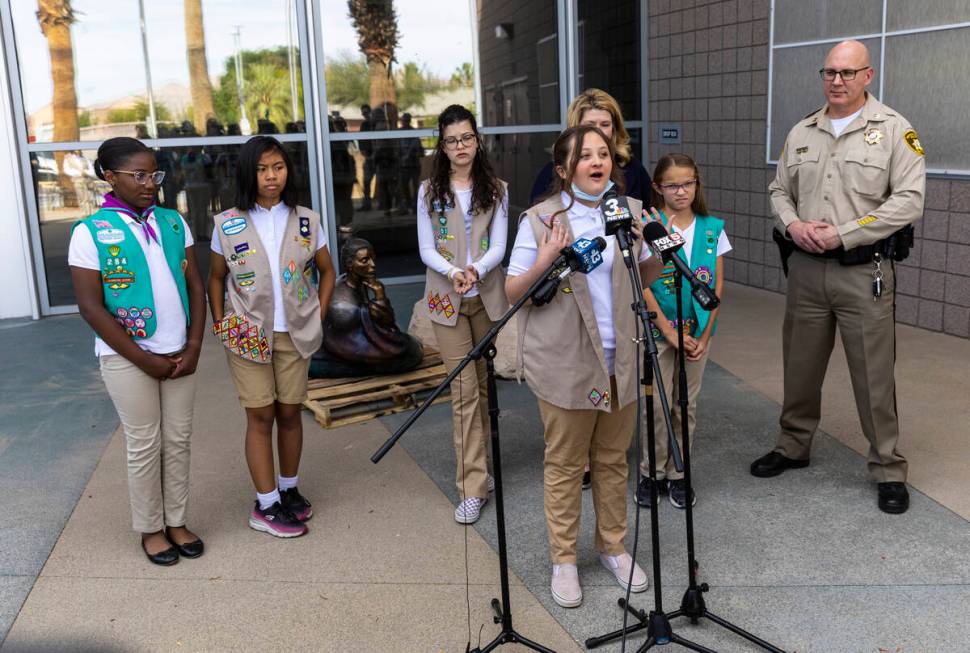 Khloee, 12, of Girl Scout Troop 702, talks about the recovery of the statue “In Grace&#x ...