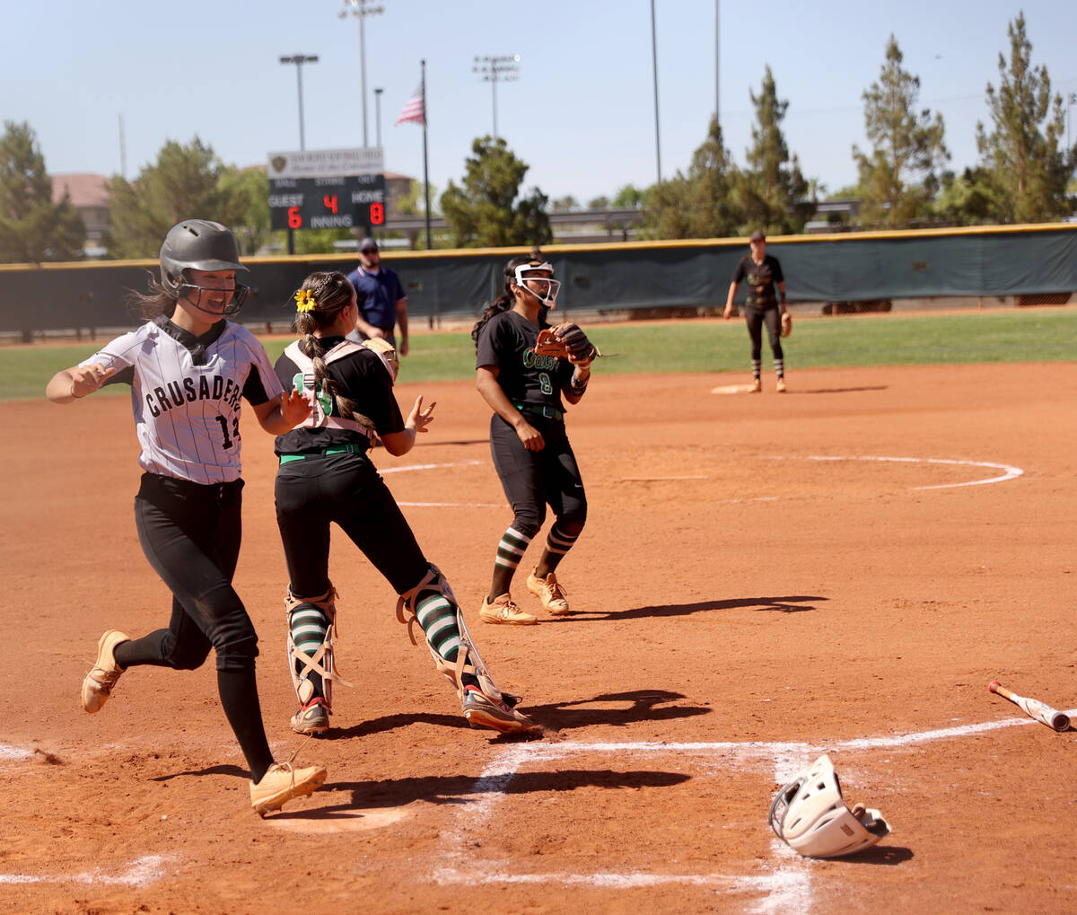 Faith Lutheran’s Averi O (14) scores against Green Valley in the 4 inning in their Class ...