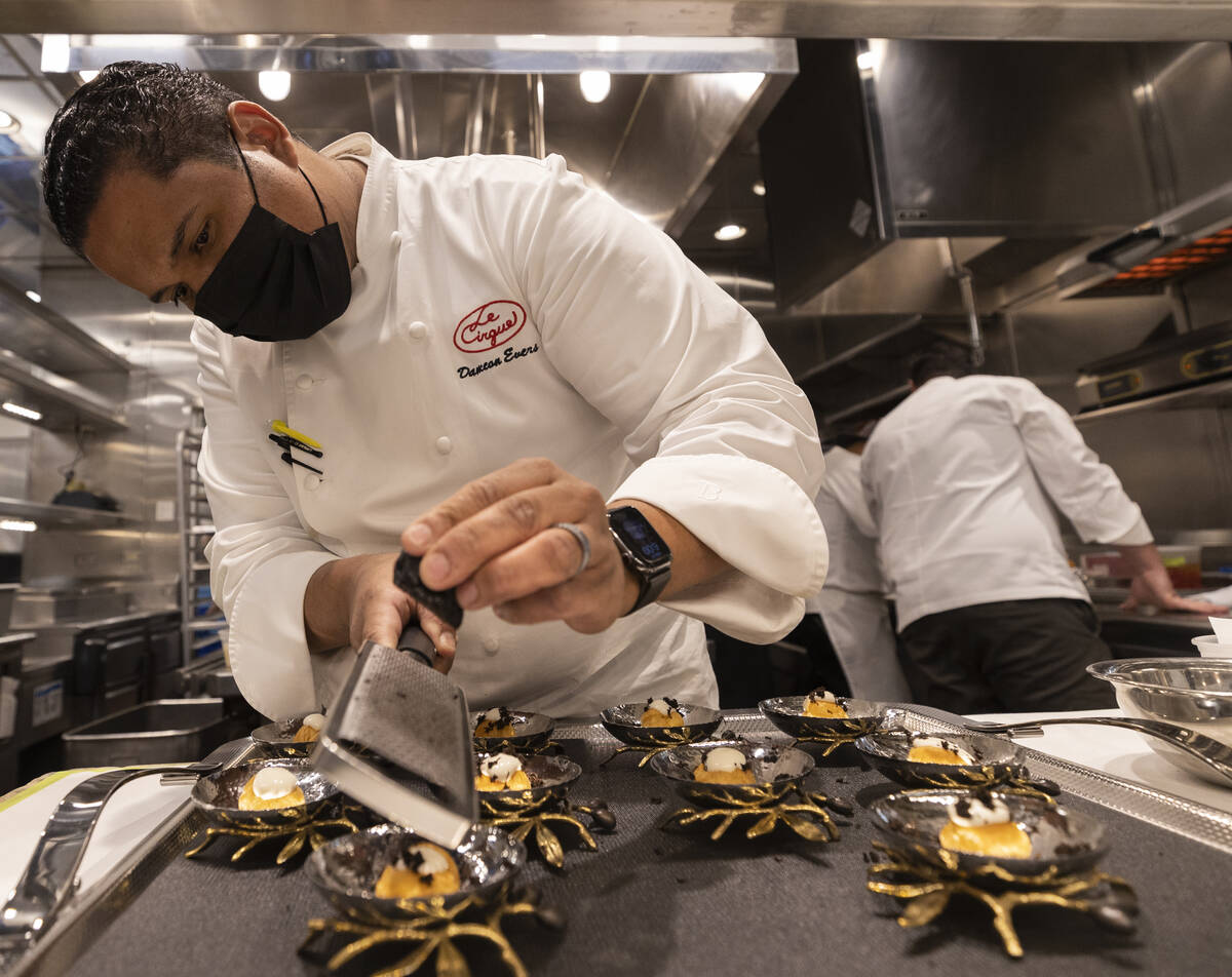 Executive Chef Dameon Evers prepares gougere with black winter truffle fondue at Le Cirque on ...