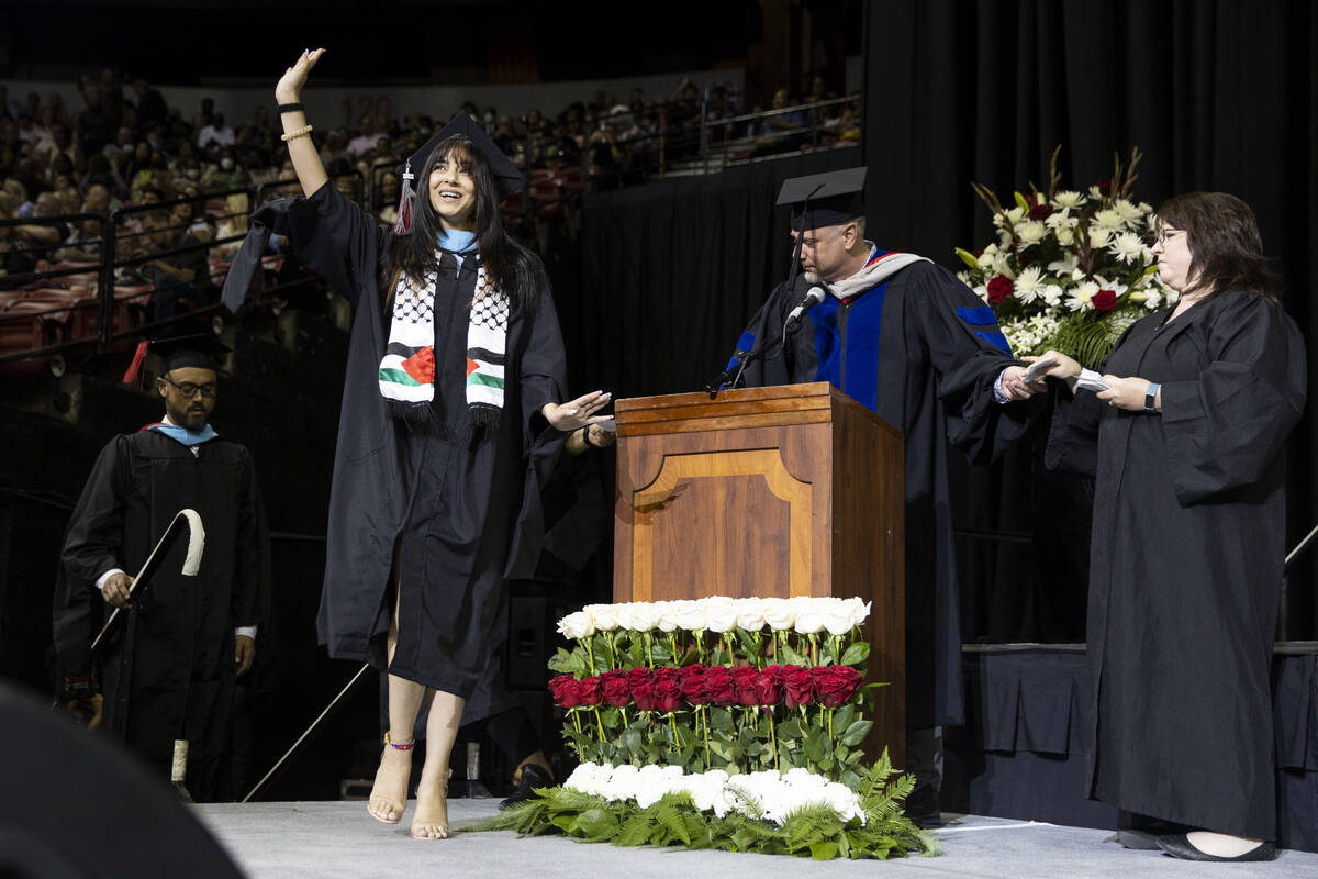Postgraduate Shehd Azzeh walks the stage during an UNLV commencement ceremony at the Thomas &am ...