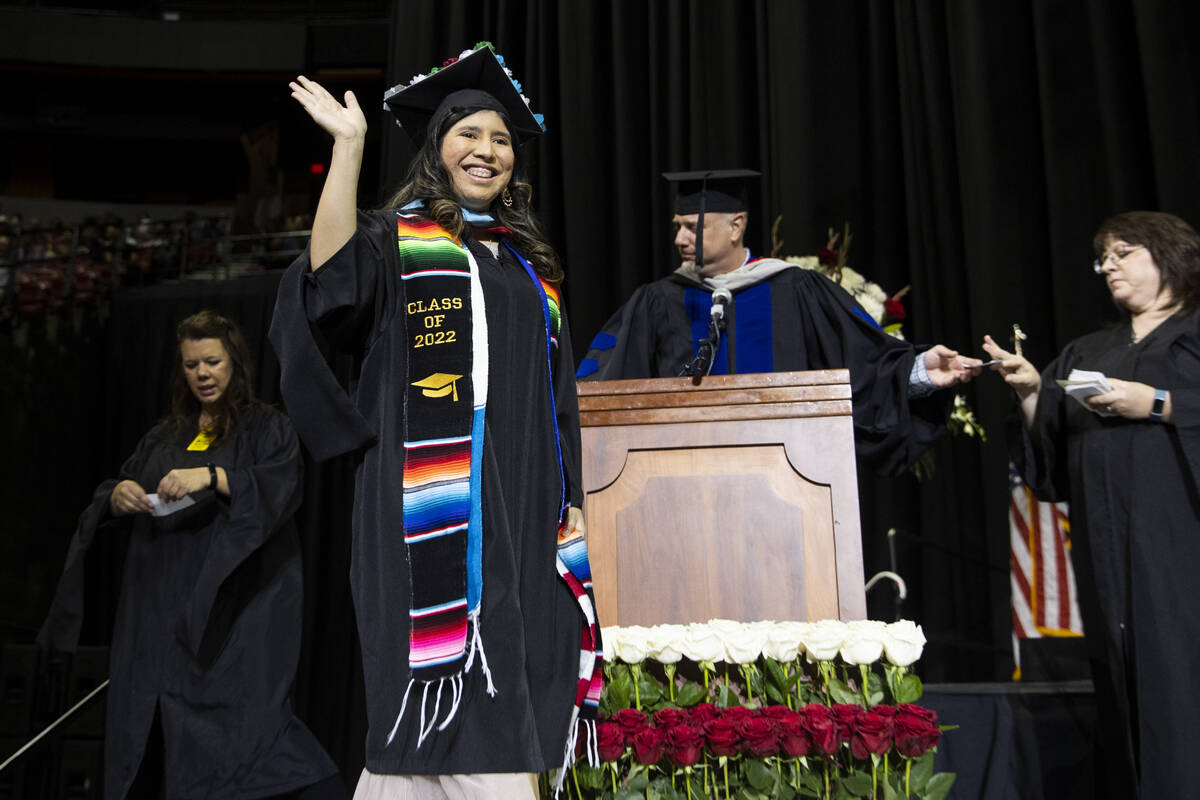 Postgraduate Angie Belicia Pop walks the stage during an UNLV commencement ceremony at the Thom ...
