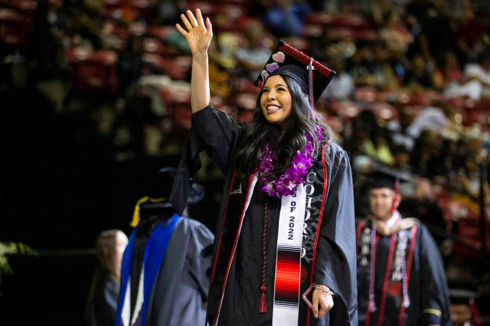 Postgraduate Monica Chairez walks the stage during an UNLV commencement ceremony at the Thomas ...