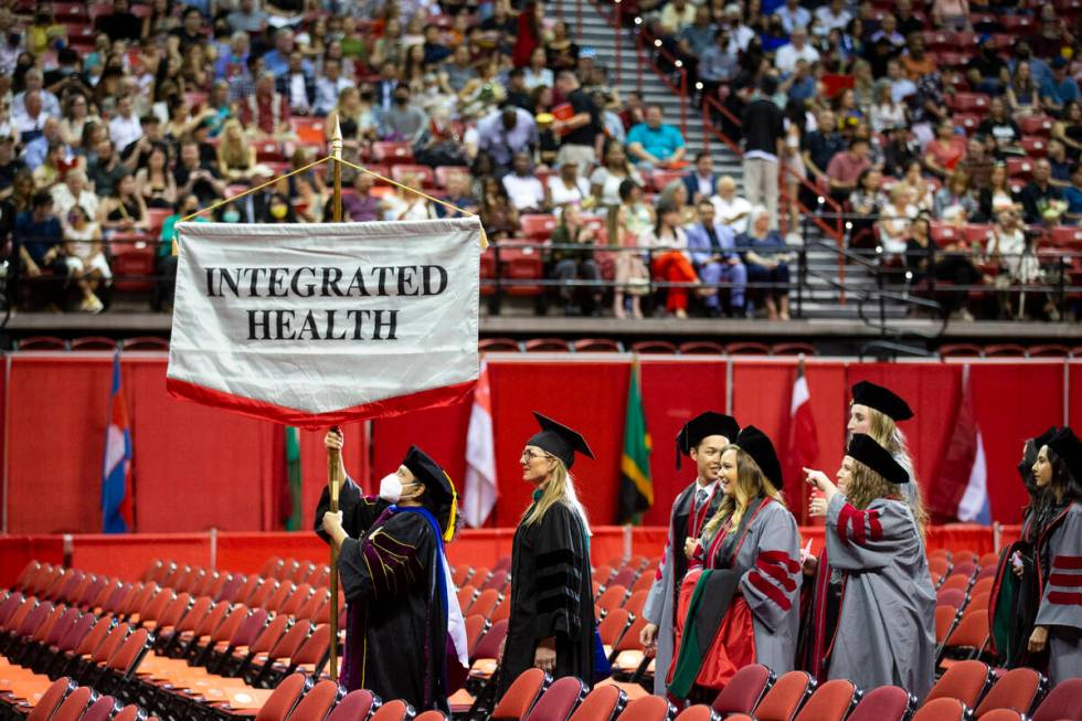 Postgraduates participate during an UNLV commencement ceremony at the Thomas & Mack Center ...