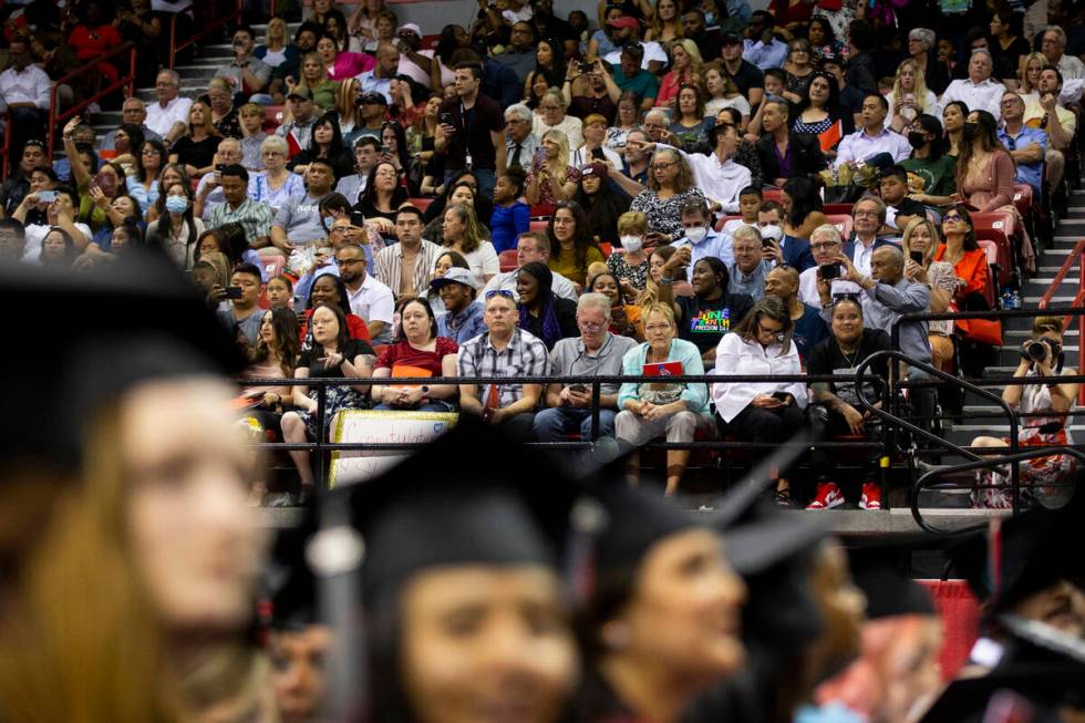 People attend an UNLV commencement ceremony at the Thomas & Mack Center in Las Vegas, Frida ...