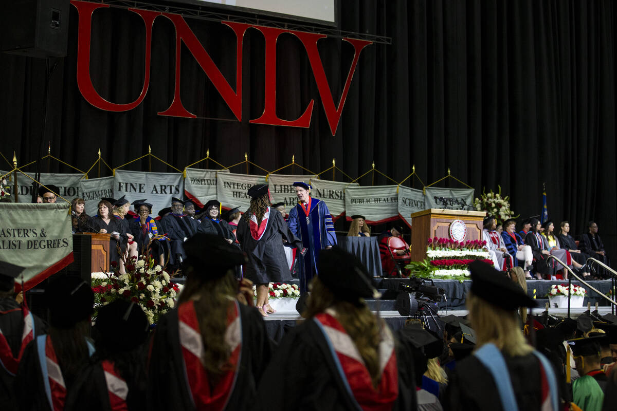 Postgraduates walks the stage during an UNLV commencement ceremony at the Thomas & Mack Cen ...
