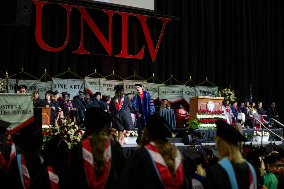 Postgraduates walks the stage during an UNLV commencement ceremony at the Thomas & Mack Cen ...