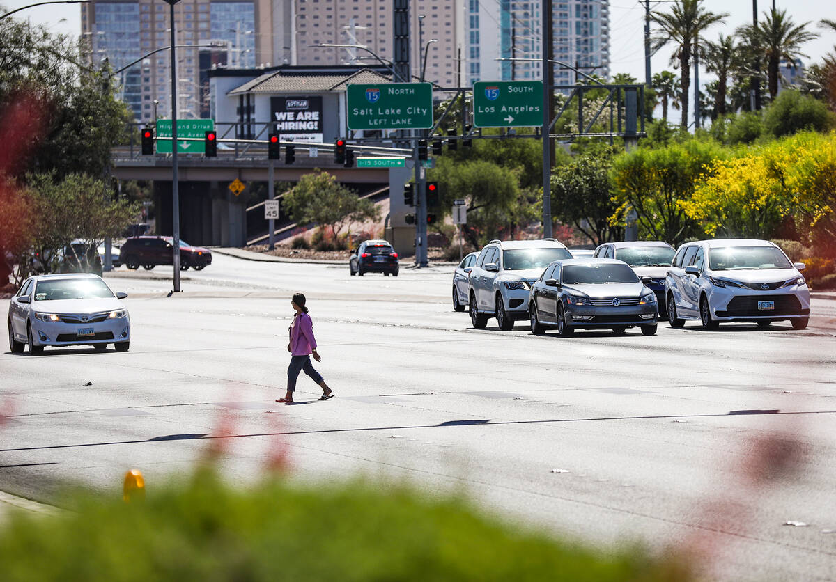 A pedestrian crosses Sahara Avenue in front of Palace Station in Las Vegas, Sunday, May 15, 202 ...