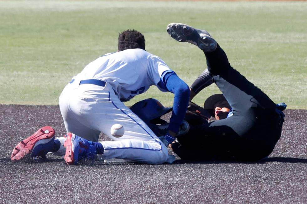 Bishop Gorman's Justin Crawford, left, slides safely into the second base as BasicÕs Jesus Per ...