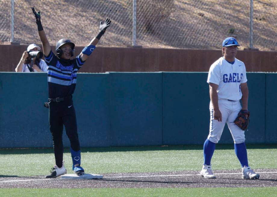 Basic's Ty Southisene (3) gestures after he reached the third base as Bishop Gorman's Gunnar My ...