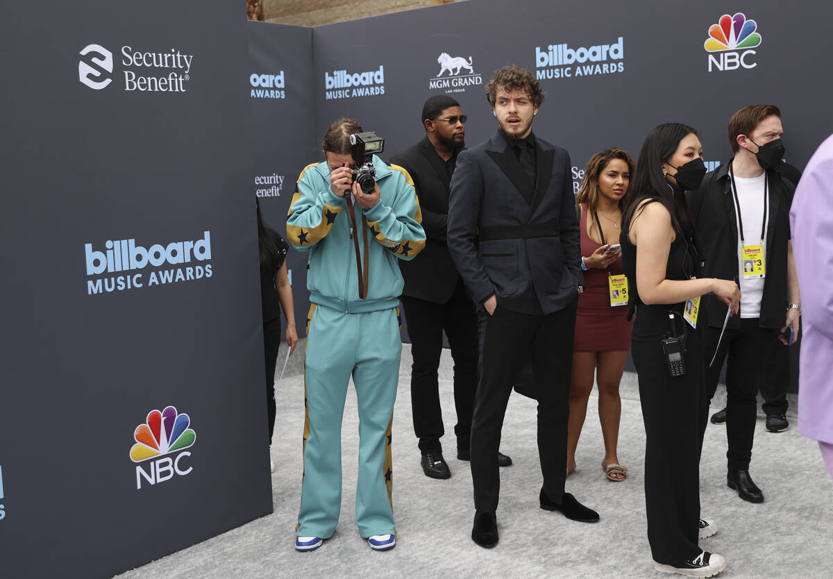 Jack Harlow, center right, prepares to walk on the red carpet for the Billboard Music Awards at ...