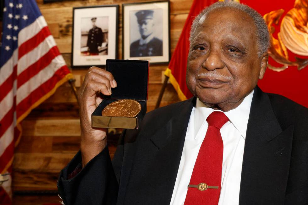 Henry Franklin Jackson, 96, shows his Congressional Gold Medal, Saturday, May 14, 2022, after r ...