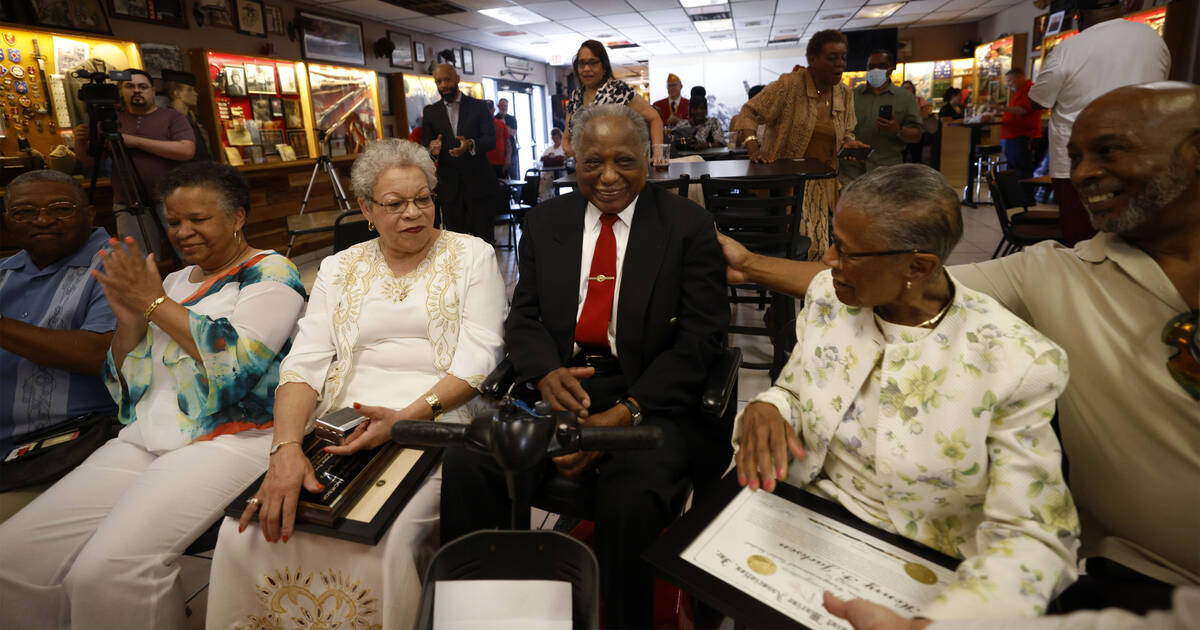 Henry Franklin Jackson, 96, center, of Las Vegas is congratulated after receiving a Congression ...