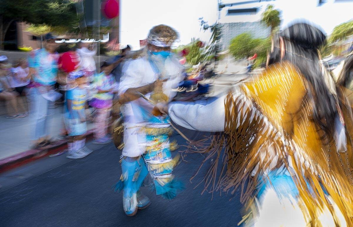 Native dancers move about the street during the Las Vegas Day Parade moving northbound along Fo ...