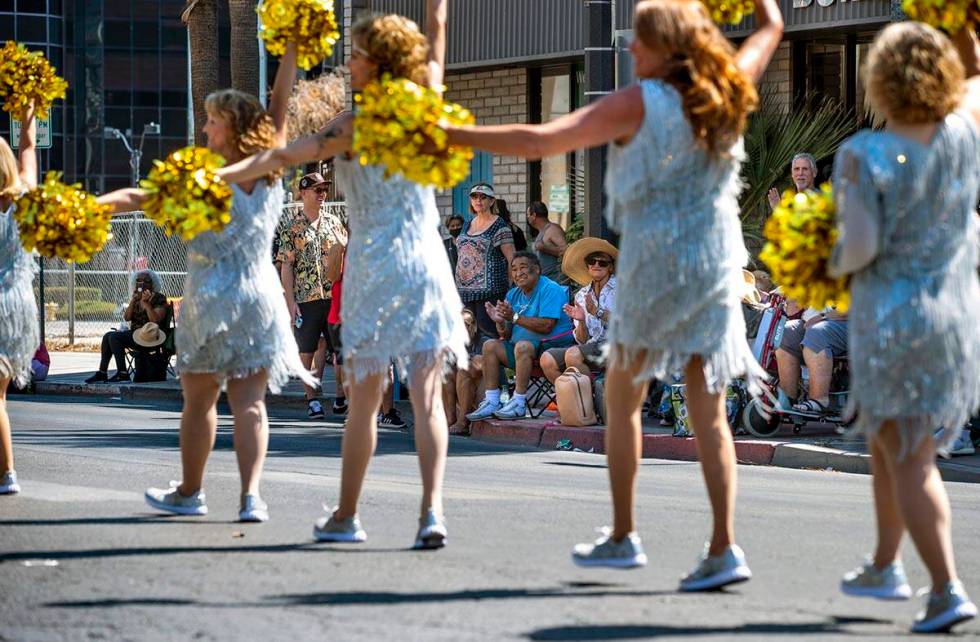 The crowd applauds for the Vegas Golden Gals dancers as they perform in the Las Vegas Day Parad ...