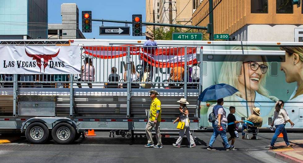 Attendees make their way during the Las Vegas Day Parade as it moves northbound along Fourth St ...
