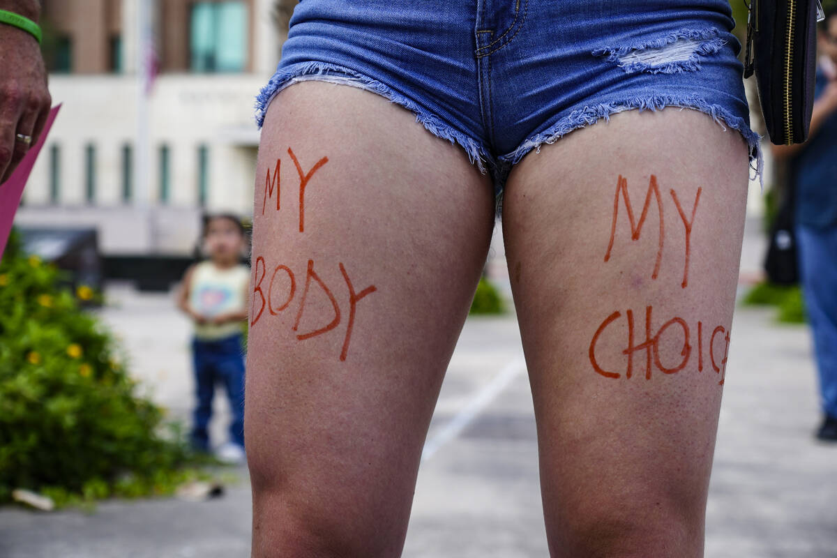 "My Body My Choice" is written in marker on Ada Sadlier's thighs Saturday, May 14, 20 ...